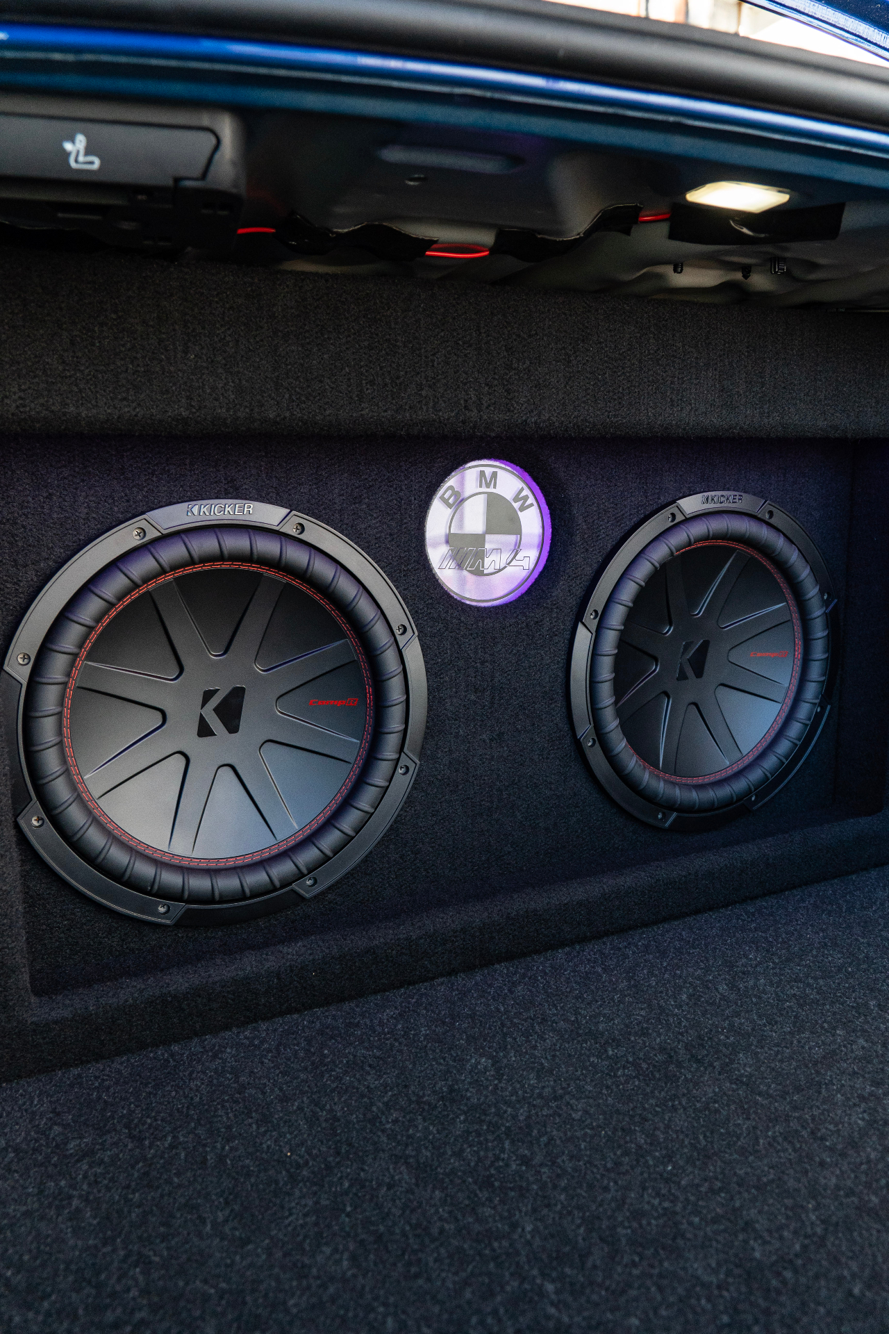 Custom BMW trunk audio build with dual Kicker CompQ subwoofers