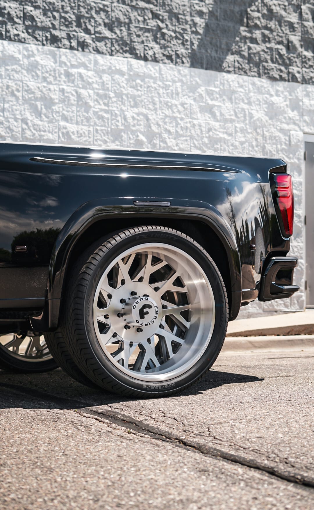 Black GMC Denali dually rear quarter on Forgiato Duro wheels