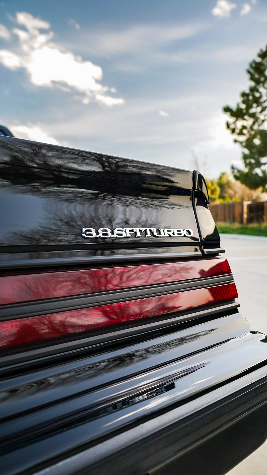 Close-up of 3.8 SFI Turbo badge and taillights on Buick Grand National